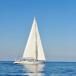White Sailboat in Beautiful Summer Day